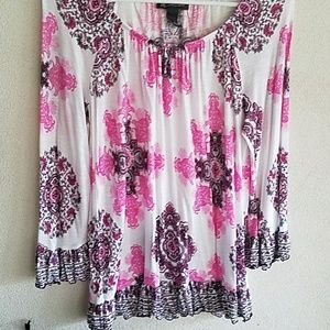 Donated Inc white, pink, and black patterned shirt